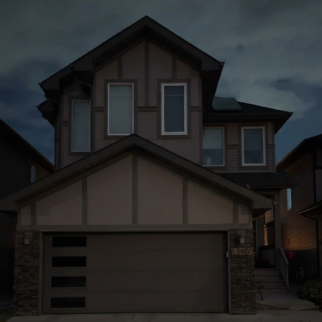 The same home at the same dusk with no lighting installed
